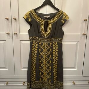Women’s dress Nanette Lapore charcoal with yellow embroidered design.